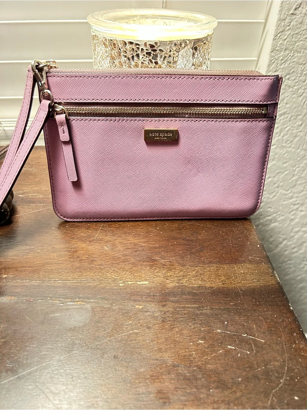 kate spade mauve wristlet with front zip pocket